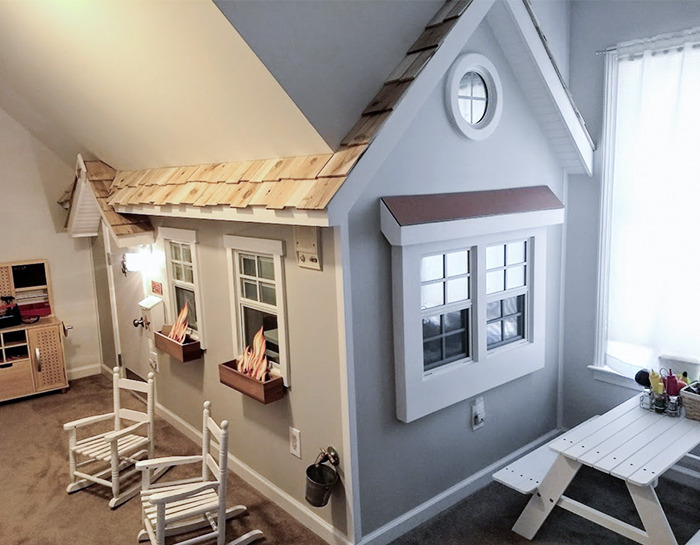 Mi marido construyó esta casa de juegos de interior para nuestros hijos adoptivos, con cocina, ventanas que funcionan de verdad y luces