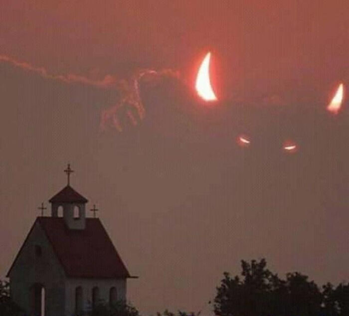 Sun During A Solar Eclipse Behind Some Clouds