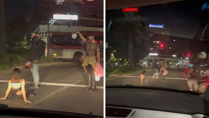 Influyentes vergonzosos en la calle durante la noche, olvidando el sentido común y la moral en la vía pública.