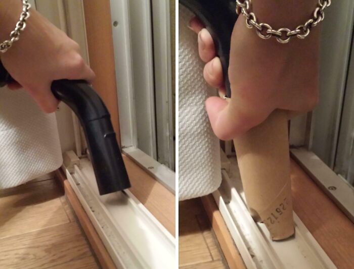 Mano usando un tubo de cartón para limpiar con aspiradora los espacios estrechos, ejemplo de life hacks geniales y prácticos.