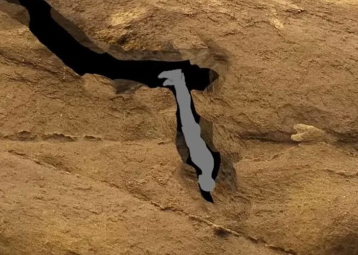 Persona atrapada en una estrecha cavidad en Nutty Putty Cave explorando la peligrosa cueva angosta. Persona atrapada en una estrecha cavidad en Nutty Putty Cave explorando la peligrosa cueva angosta.