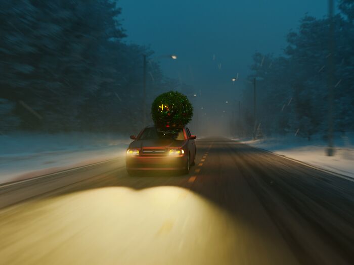 Coche conduciendo de noche en carretera nevada, imagen que representa manifestaciones instantáneas de karma satisfactorio.